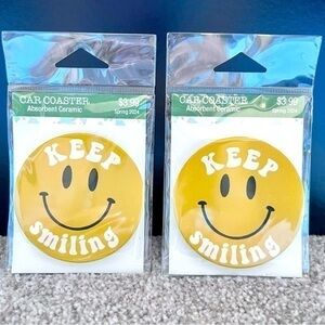 NWT set of two ceramic absorbent car cup holder coasters “Keep Smiling”